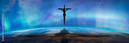 Fotografia Jesus on the cross over the clouds with aurora borealis (Northern lights), jesus