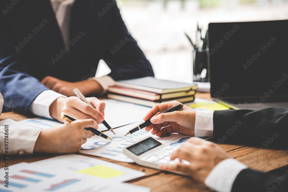 Teamwork with price chart analyzes business people on the table at the conference room. Teamwork with price chart analyzes business people on the table at the conference room.