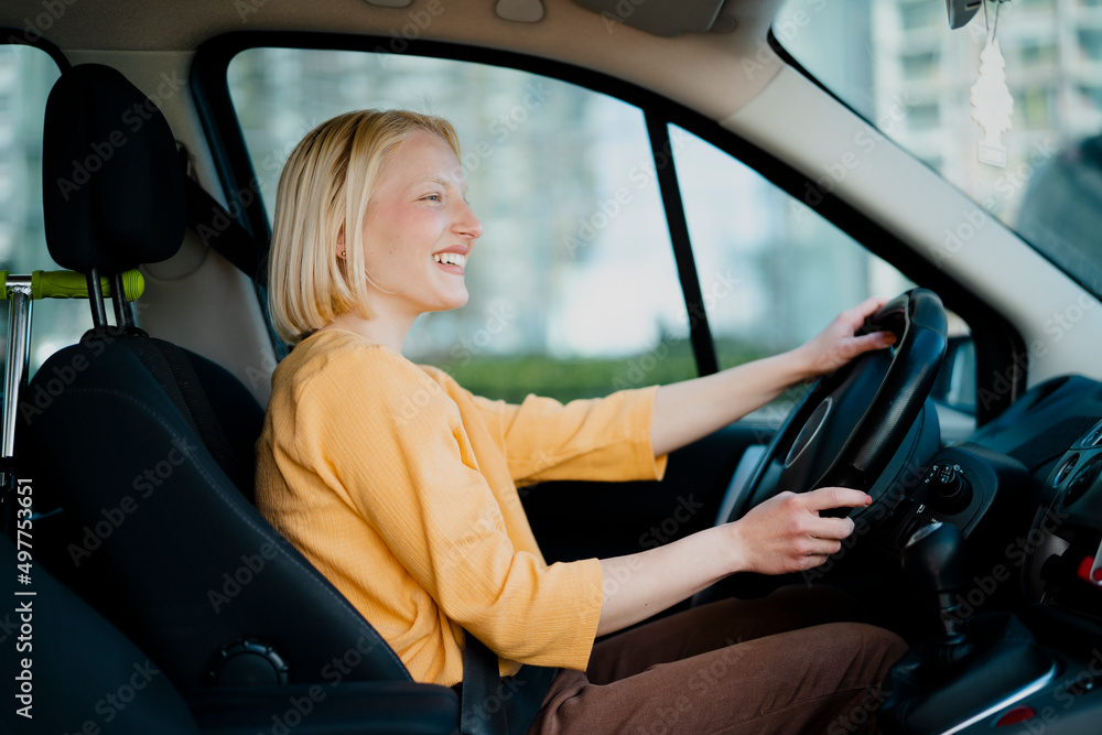 Beautiful woman driving a car.