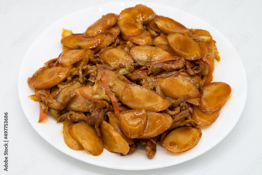 Shanghainese Rice Cakes with Pork on a White Plate