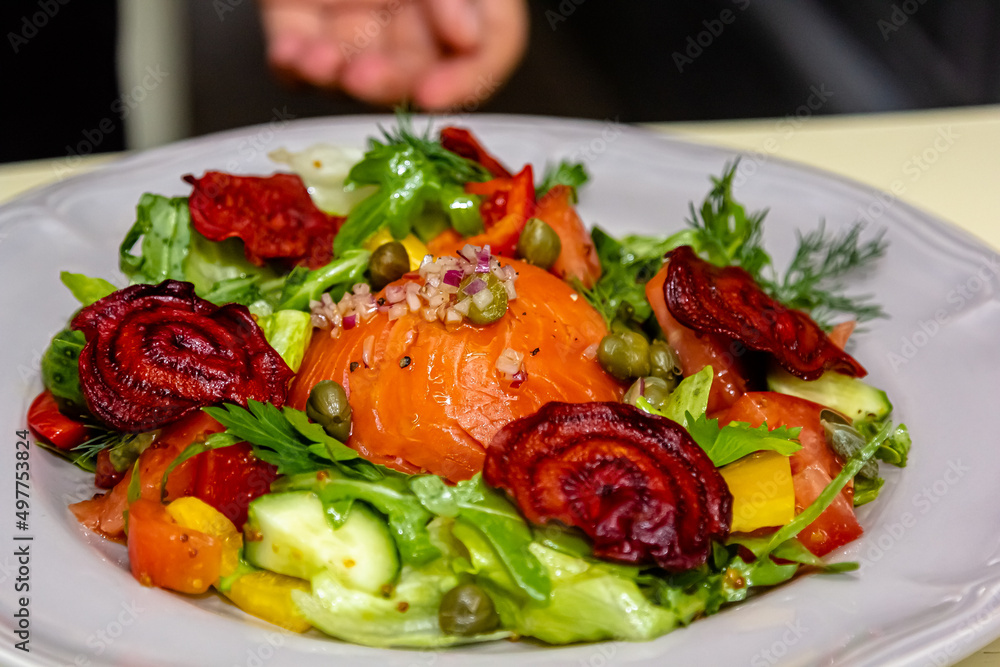 Salad with salmon, cucumbers, tomatoes and beets Salad with salmon, cucumbers, tomatoes and beets