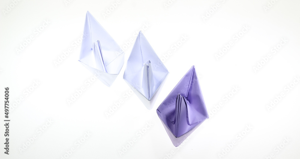 Paper boat isolated on a white background.Concept for creative and business ideas. Paper boat isolated on a white background.Concept for creative and business ideas.