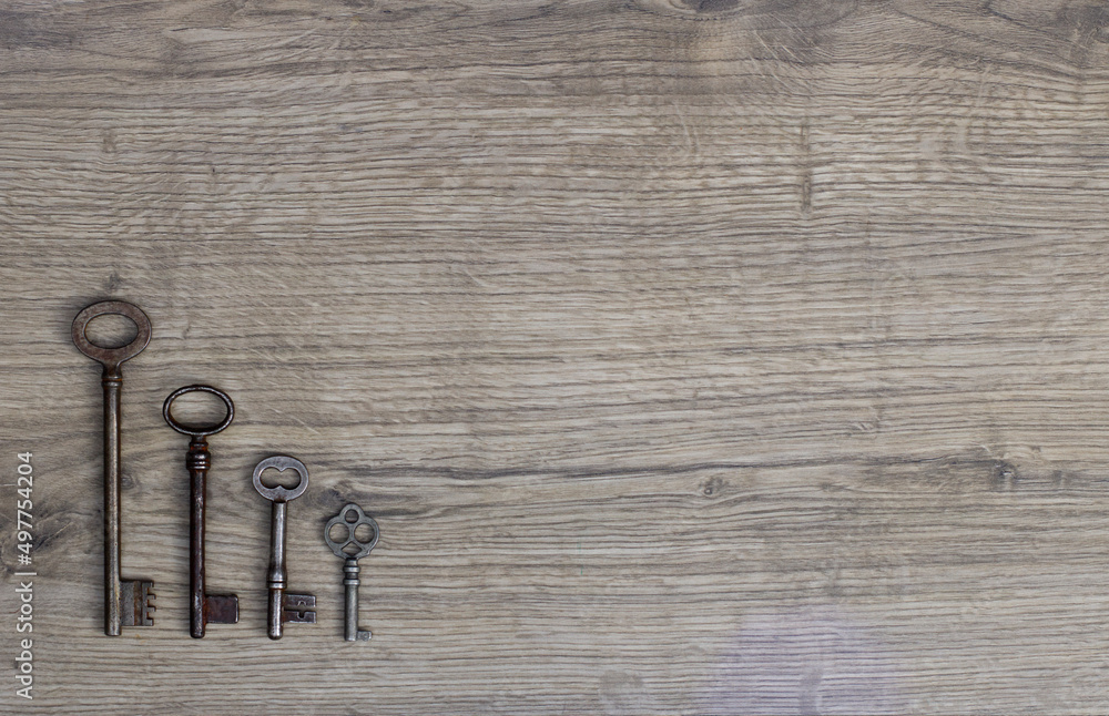 Old keys on a wooden background. Old keys on a wooden background.