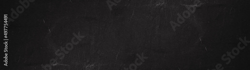 Black grey anthracite stone concrete scratched weathered grunge wall or floor texture background panorama banner long © Corri Seizinger