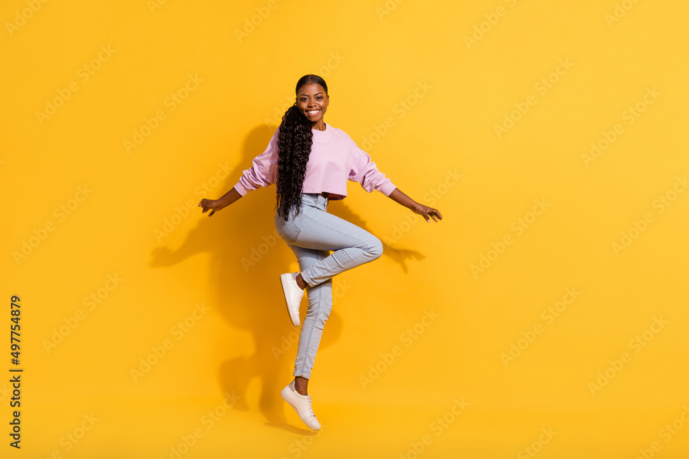 Full size portrait of active sportive person enjoy free time holiday isolated on yellow color background Full size portrait of active sportive person enjoy free time holiday isolated on yellow color background