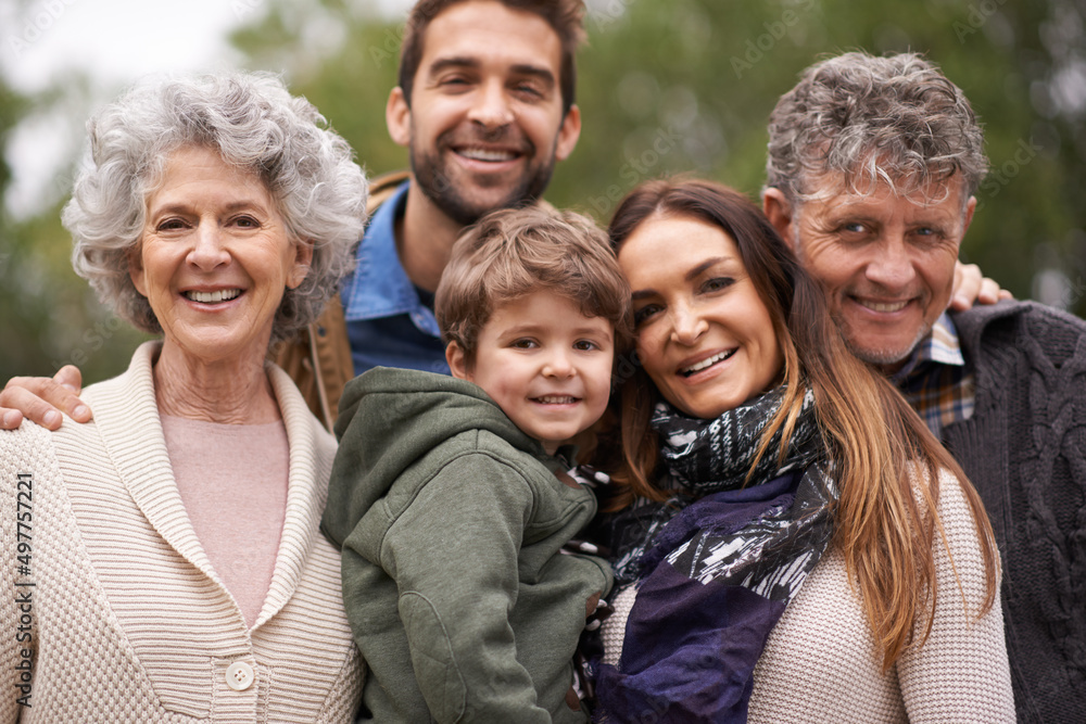 One big happy family. Portrait of a happy multi-generation family standing outdoors. One big happy family. Portrait of a happy multi-generation family standing outdoors.