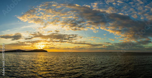 Fototapeta Naklejka Na Ścianę i Meble -  atmosphere of sunset over the sea, the clouds, and the light of the sun breathtaking.