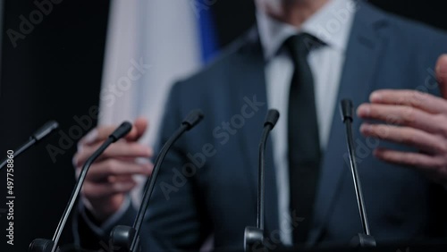 French politician delivering speech, summit speaker, giving press conference photo