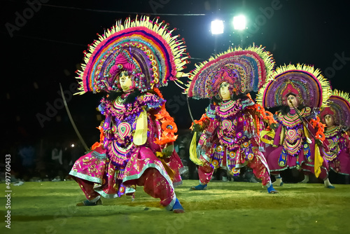 BAMNIA, PURULIA, WEST BENGAL , INDIA - DECEMBER 23RD 2015 : Four dancers performing at Chhau Dance festival. It is a very popular Indian tribal martial dance performed at night amongst spectators. photo