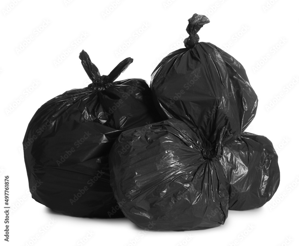 Black trash bags full of garbage on white background Black trash bags full of garbage on white background