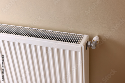 Wallpaper Mural Modern radiator on beige wall. Central heating system Torontodigital.ca