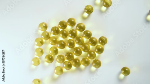 Vitamin d3 capsules on a white background close-up.