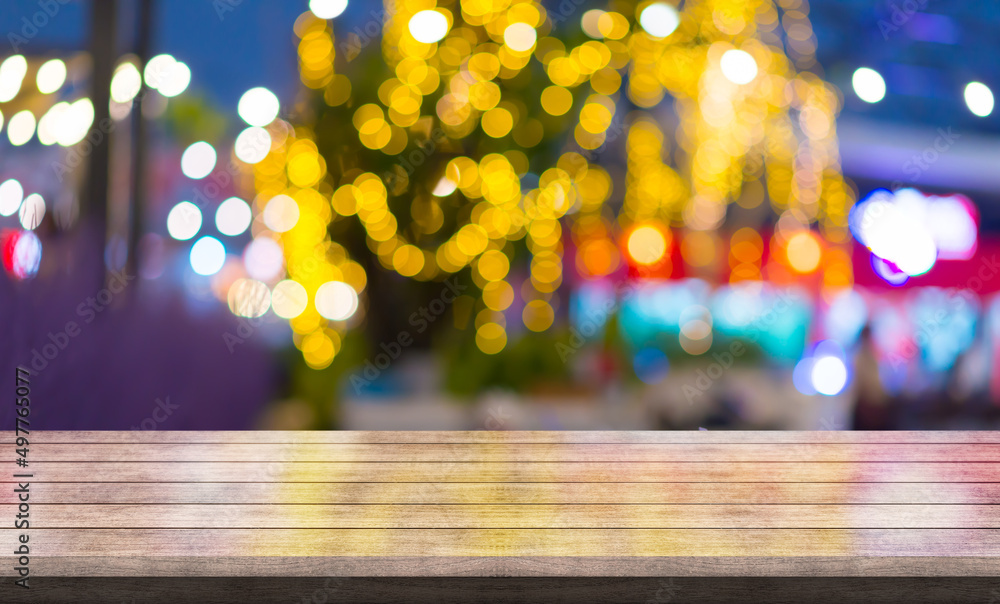 Empty wooden table top with lights bokeh on blur restaurant background. Empty wooden table top with lights bokeh on blur restaurant background.