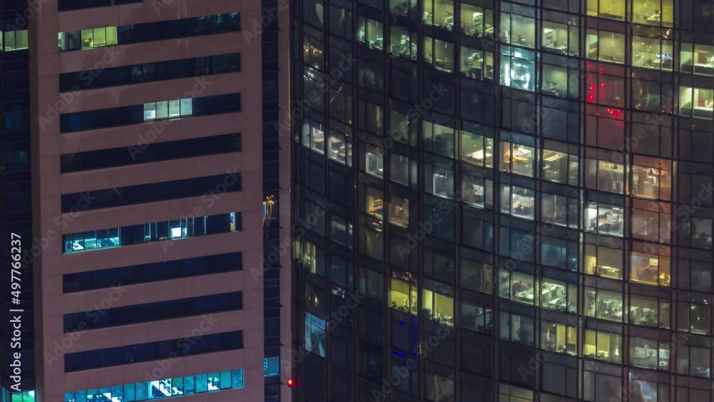 Windows in high-rise building exterior in the late evening with interior lights on timelapse Windows in high-rise building exterior in the late evening with interior lights on timelapse