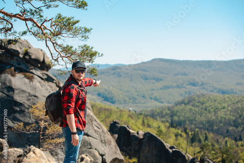 man hiker with backpack at dovbush rocks