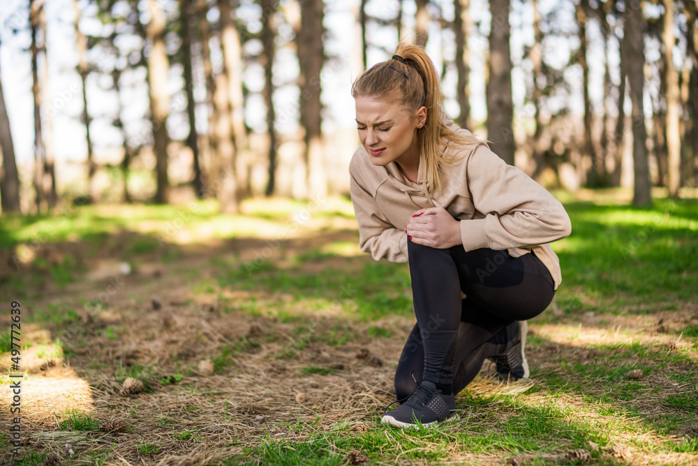 Woman has got sport injury from exercising. Woman has got sport injury from exercising.