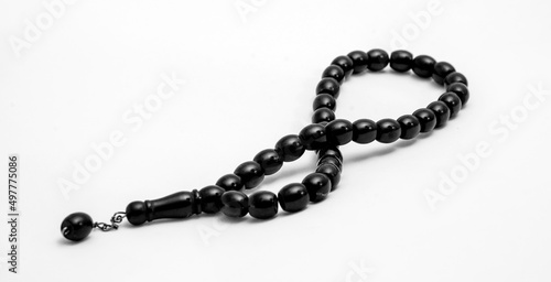 Black prayer beads on a white background photo