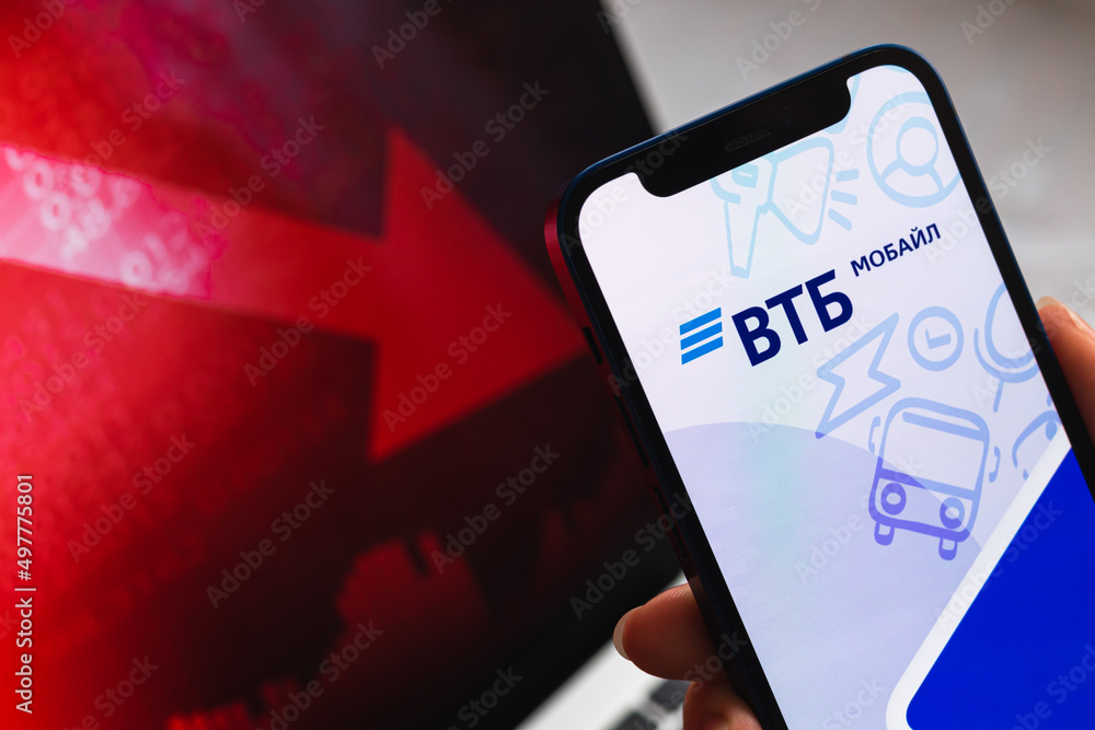 VTB bank red stock market. Financial default and loss. Mobile phone with  logo Stock Photo | Adobe Stock
