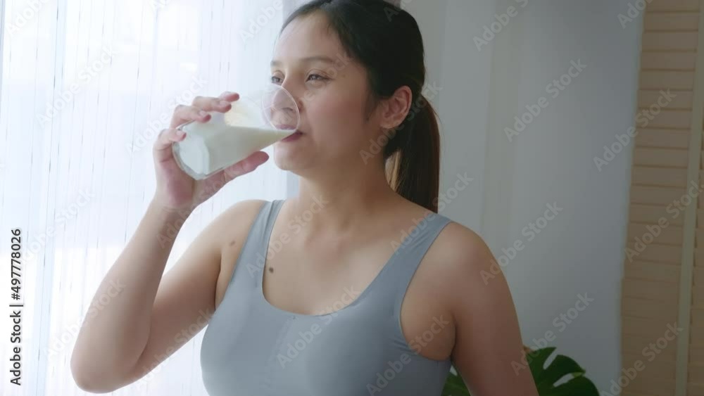 Young pregnant woman drinking milk at home, healthcare and pregnancy care Young pregnant woman drinking milk at home, healthcare and pregnancy care