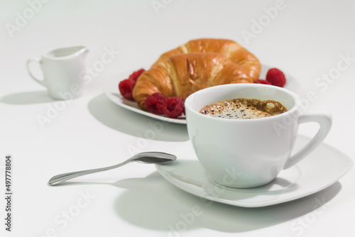 Fresh coffee in white cup, breakfast concept