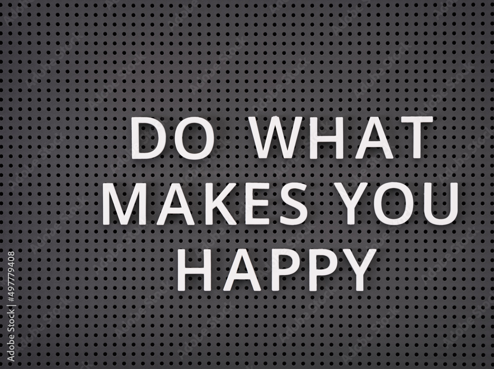 Phrase Do What Makes You Happy spelled out with white letters on gray pegboard