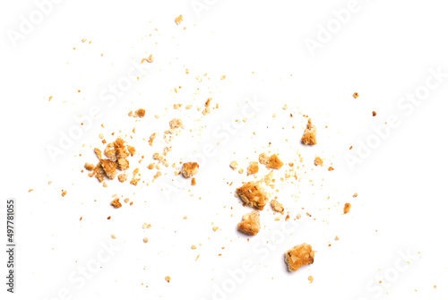 Foto Scattered crumbs of vanilla chip butter cookies isolated on white background