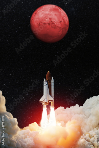 Fototapeta Naklejka Na Ścianę i Meble -  Spaceship lift off. Space shuttle with blast and smoke takes off to the red planet mars. Mars concept. Spacecraft lift off to explore other planets. Elements of this image furnished by NASA.