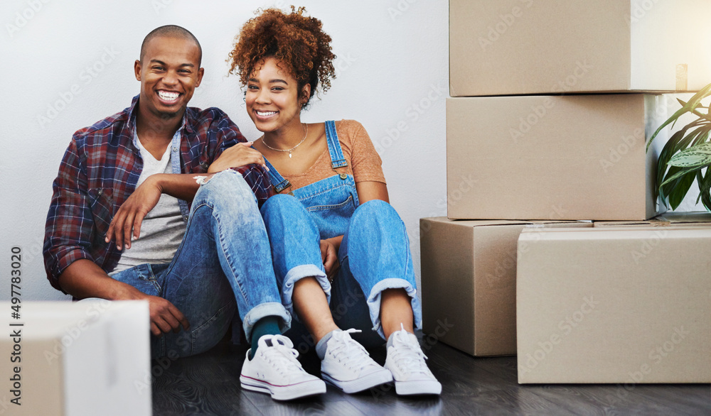 They finally on their own and loving it. Shot of an attractive young couple moving house. They finally on their own and loving it. Shot of an attractive young couple moving house.