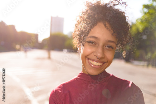 African American young woman portrait outdoors in urban landscape © Gustavo