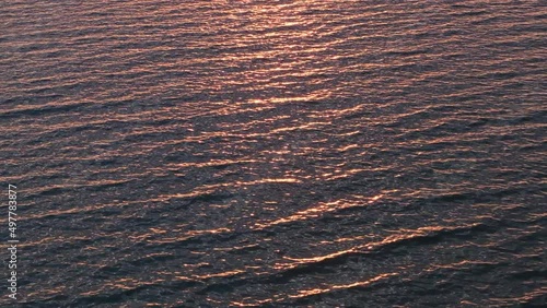 Sun track sparks on twilight big river rippled water surface. Nature background.
