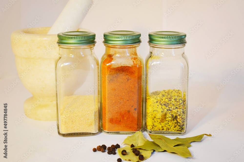 Spices and herbs in the little jars, pepper, garlic and paprika Spices and herbs in the little jars, pepper, garlic and paprika