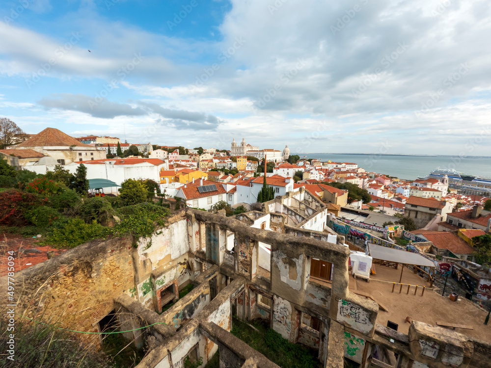 The view from miradouro, observation viewpoint of Lisbon, old architecture with red roofs in Lisbon, Portugal