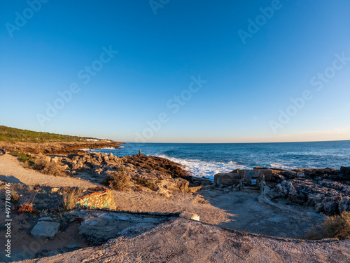 Cabo Raso Lighthouse at sunset golden light, an active Portuguese lighthouse Farol do Cabo Raso, Cascais, Portugal