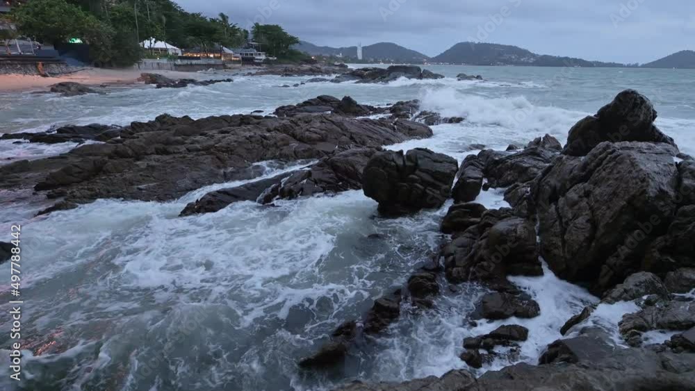 Big wave hitting the stones on coastline in storm Big wave hitting the stones on coastline in storm
