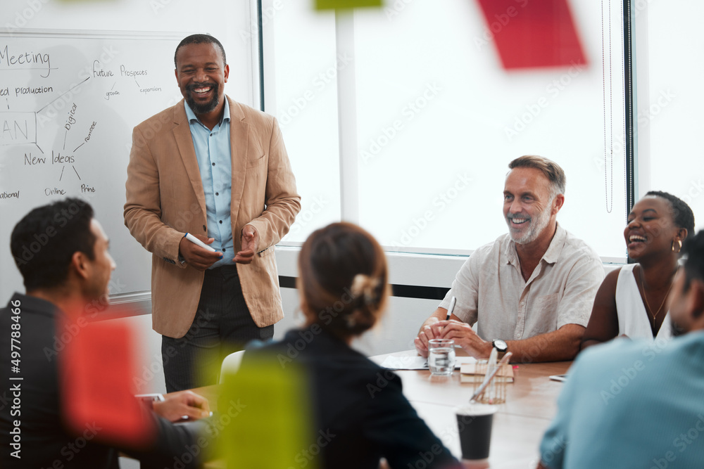 Giving his best presentation yet. Cropped shot of a handsome mature businessman giving a presentation in the boardroom. Giving his best presentation yet. Cropped shot of a handsome mature businessman giving a presentation in the boardroom.