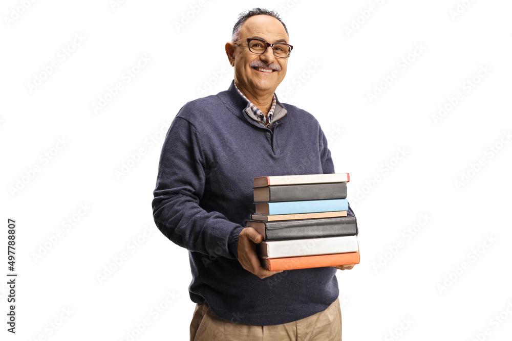 Smiling mature man holding a pile of books - obrazy, fototapety, plakaty 
