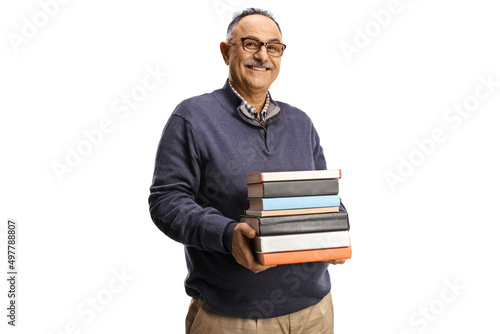 Smiling mature man holding a pile of books