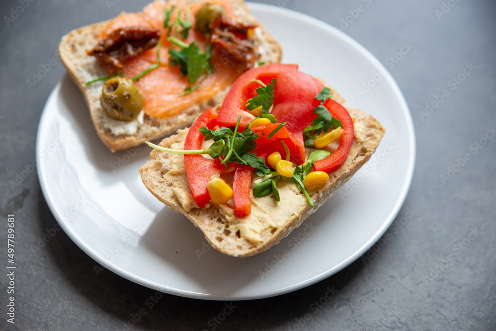 Tasty homemade breed with vegetable on stone background