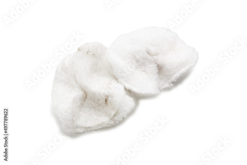 Used old hygienic cotton pads for wiping and facial skin care on a white background. Disposable cotton rounds for rubbing over the face. Care and hygiene sponge items.