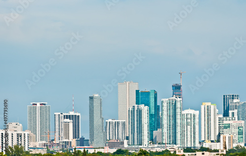 front view, very far distance of the Miami, Florida skyline at mid-morning, looking toward the ocean