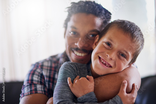 Theyll always be best buddies no matter what. Portrait of a father and son spending some quality time together at home.