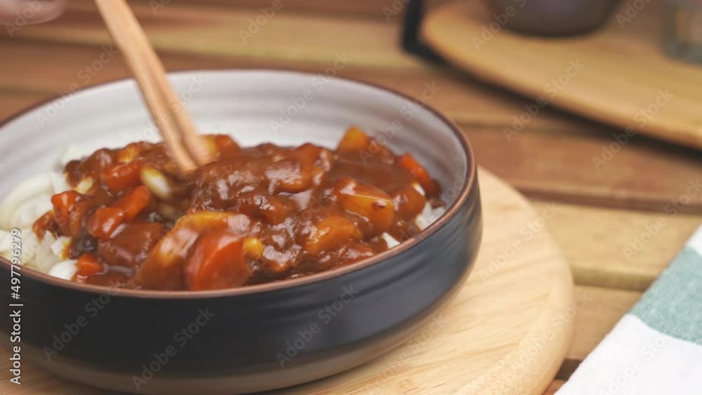 video to the bowl of curry noodle or udon is rubbed with chopsticks in Japanese food style. ready to eat meal. cuisine traditional food concept. video to the bowl of curry noodle or udon is rubbed with chopsticks in Japanese food style. ready to eat meal. cuisine traditional food concept.