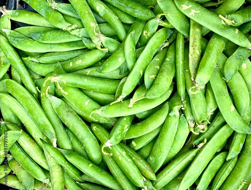 Fresh organic green beans (green peas) on a street market in London. England. Fresh organic green beans (green peas) on a street market in London. England.