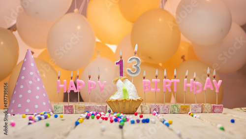Photography Beautiful background happy birthday number 13 with burning candles, birthday candles pink letters for a thirteen year old child
