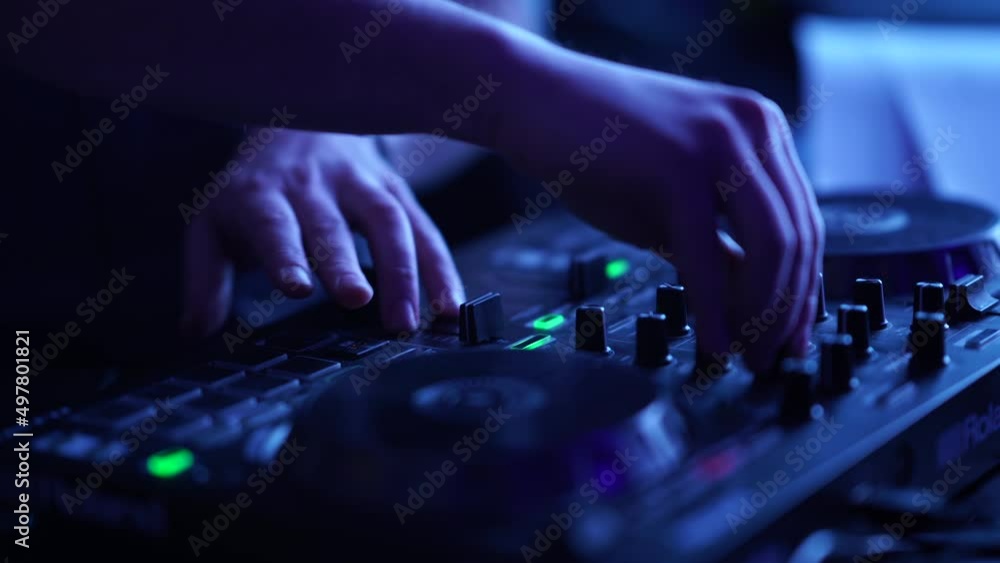DJ, playing on the DJ console DJ, playing on the DJ console