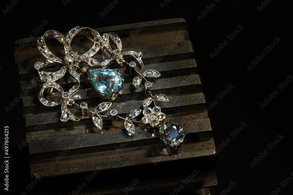 Obraz premium Craft jewelery making with professional tools. Ring repairing. Putting the diamond on the ring. Macro shot. A handmade jeweler process, manufacture of jewelery.