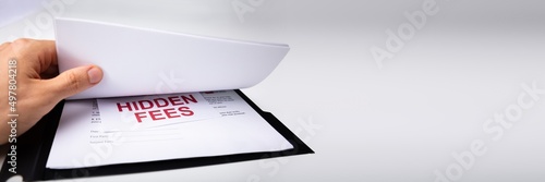 Person Looking At Hidden Fees In Contract