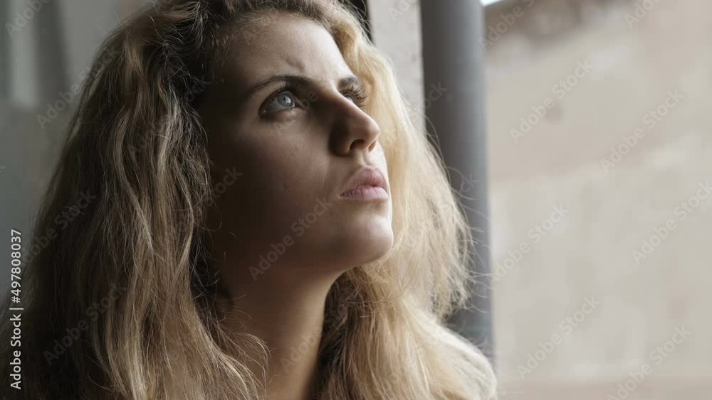 hope, faith-pensive young woman smoking a cigarette looks at the sky for comfort hope, faith-pensive young woman smoking a cigarette looks at the sky for comfort