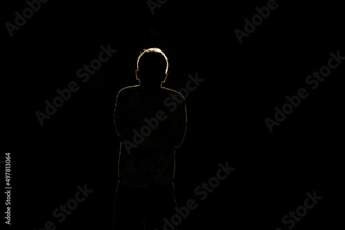 Silhouette of a man in the dark.