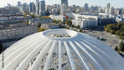 Aerial view of large and beautiful dome of the circus, Ekaterinburg, Russia. Stock footage. Residential buildings and beautiful office buildings on a summer day. photo